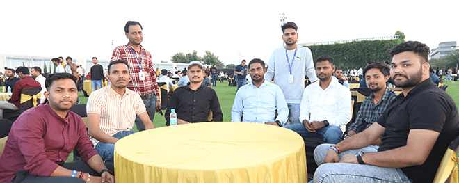 Relaxing and Connecting: A Group Moment at the College Celebration